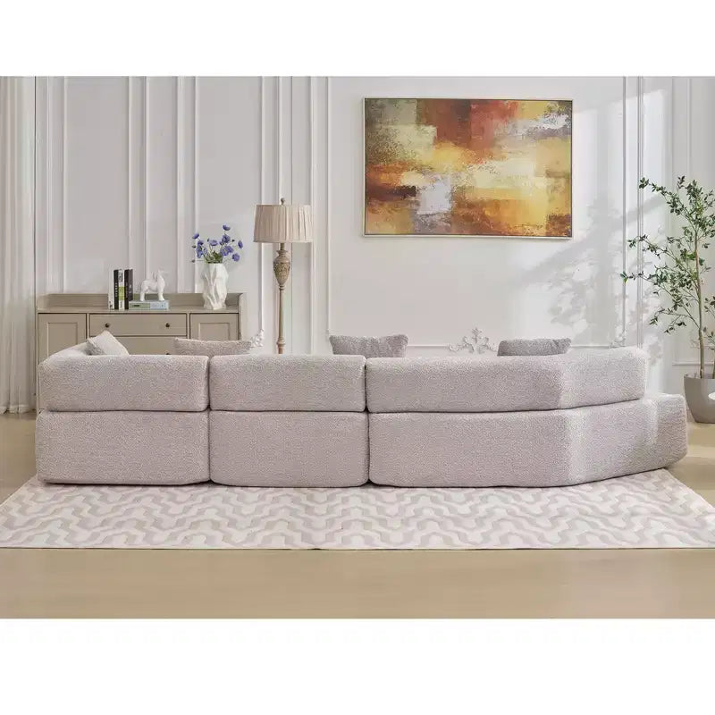 Divano componibile a L moderno da 355 cm con 4 posti, rivestimento in tessuto Boucle, 4 cuscini decorativi, nessun montaggio richiesto