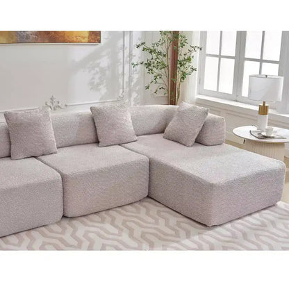 Divano componibile a L moderno da 355 cm con 4 posti, rivestimento in tessuto Boucle, 4 cuscini decorativi, nessun montaggio richiesto