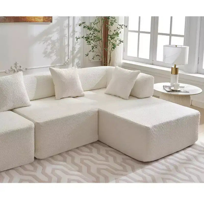 Divano componibile a L moderno da 355 cm con 4 posti, rivestimento in tessuto Boucle, 4 cuscini decorativi, nessun montaggio richiesto