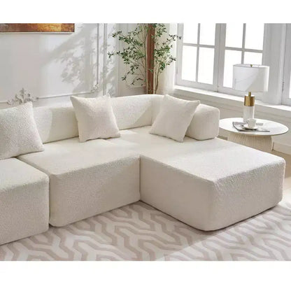 Divano componibile a L moderno da 355 cm con 4 posti, rivestimento in tessuto Boucle, 4 cuscini decorativi, nessun montaggio richiesto