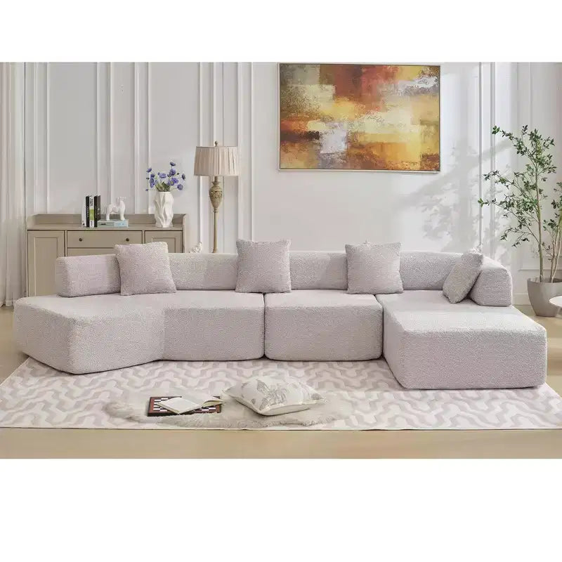 Divano componibile a L moderno da 355 cm con 4 posti, rivestimento in tessuto Boucle, 4 cuscini decorativi, nessun montaggio richiesto